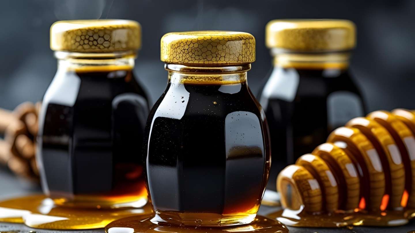 gambar madu hitam pahit asli dalam botol